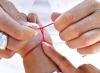Why wear a red, pink or blue thread on your wrist