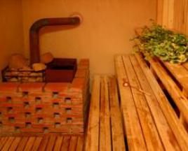 Sauna berbahan bakar kayu dan kompor sauna: logam dan batu bata